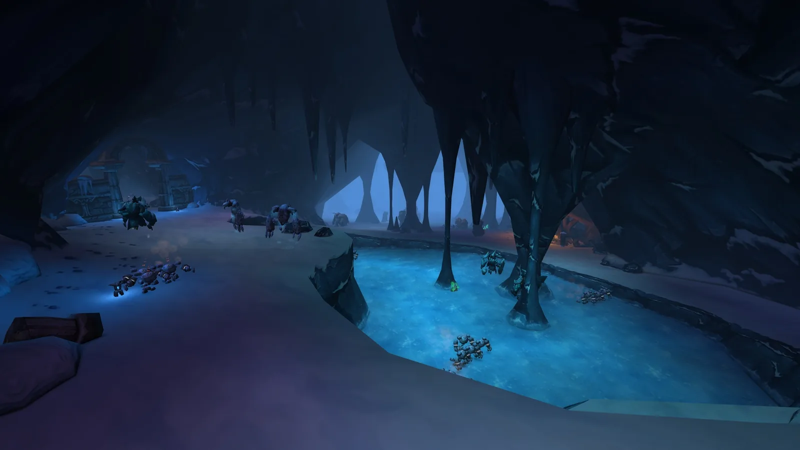 Blue-lit cave with stalactites