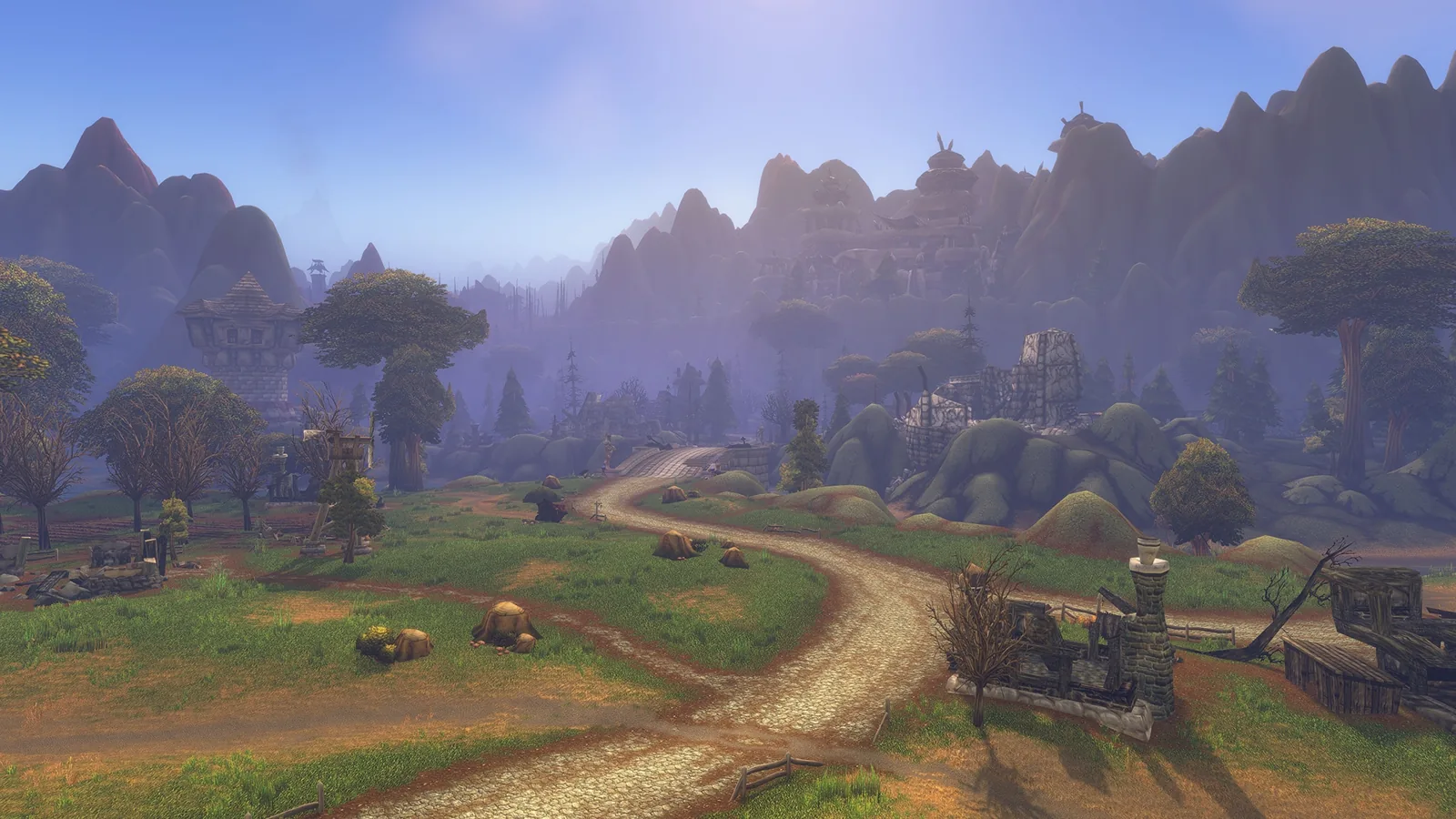 A dirt road through rolling hills