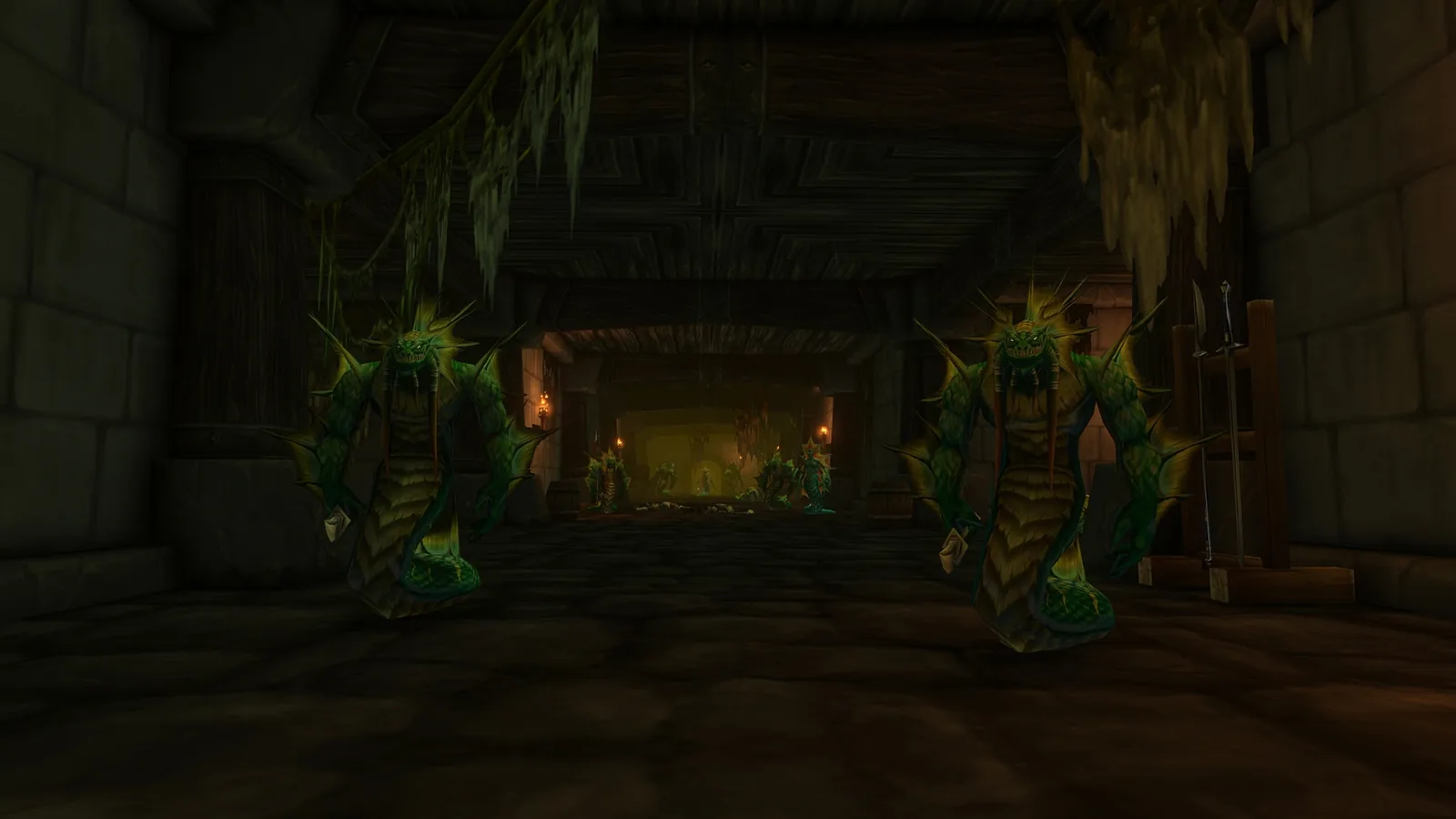 Two green-armoured figures in a dark hall